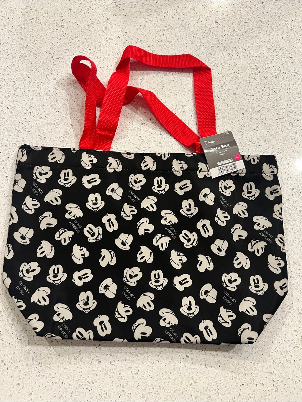 Disney Mickey Mouse tote bag with white Mickey Mouse faces on black background
